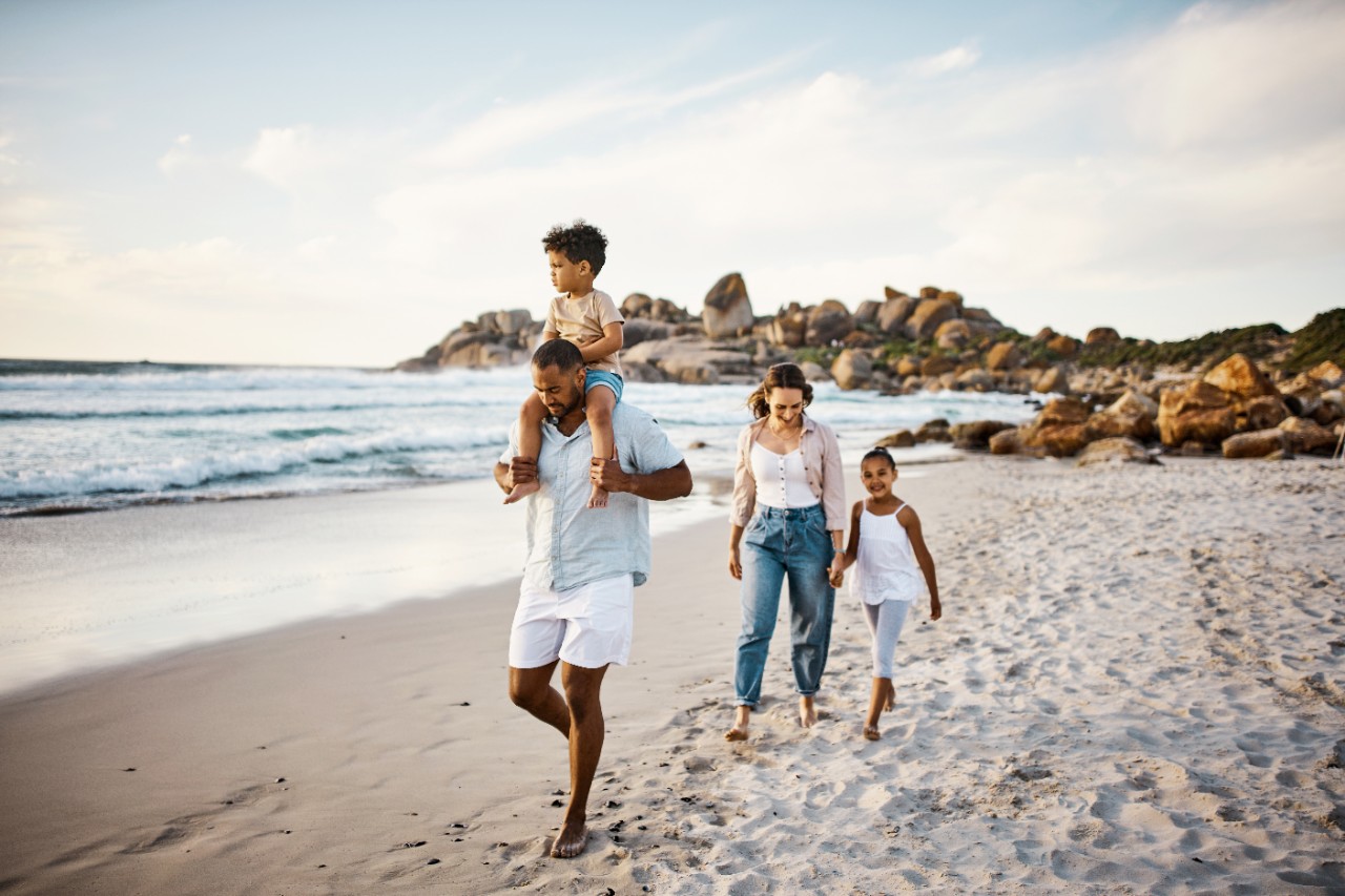 Family walking together along a beach