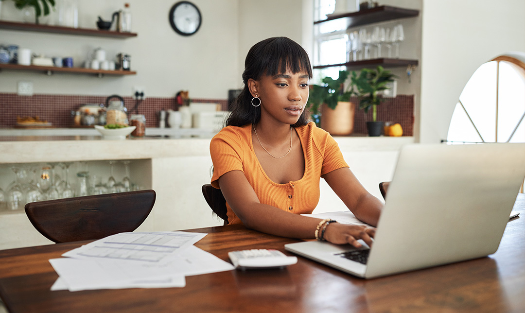 Young person working at laptop