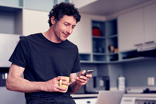 Woman using tablet wearling headphones