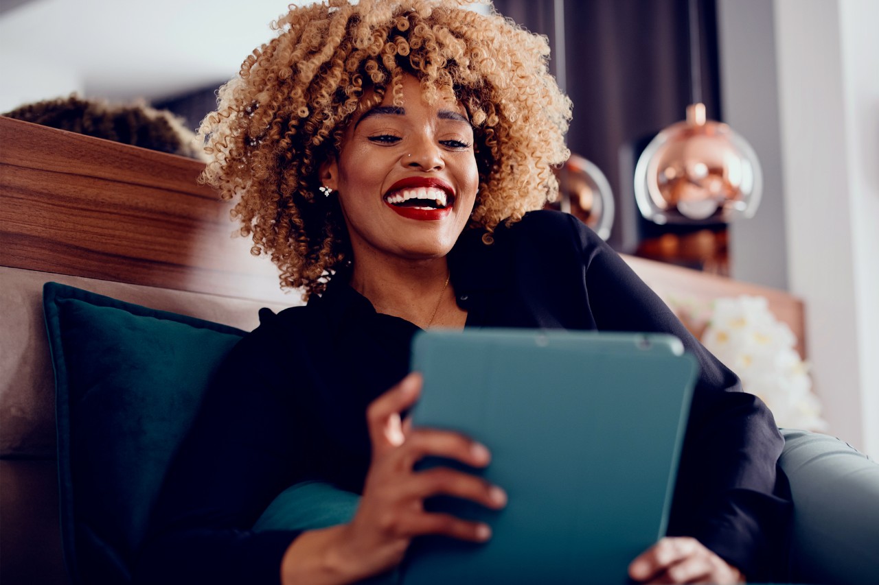 Woman talking to someone on her tablet