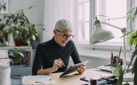 Woman looking through office glass