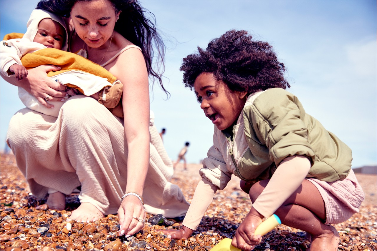 Mother and son on the beach thinking about NatWest Investment