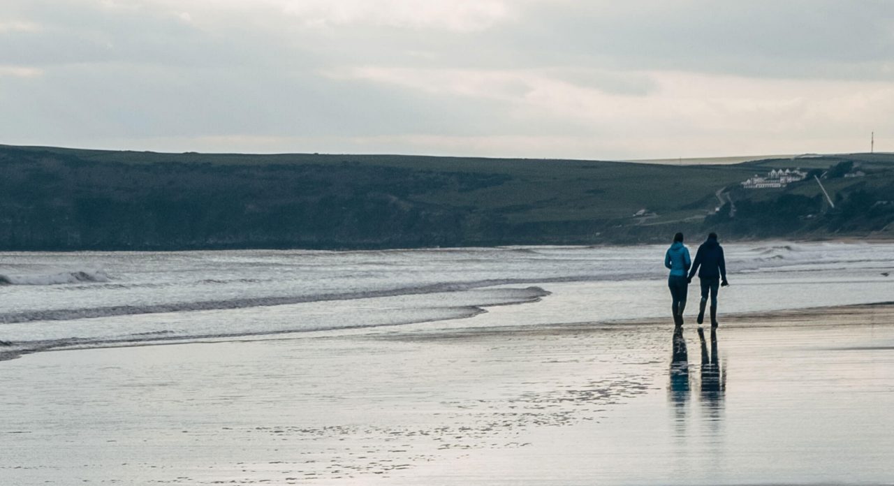 couple walking along the beach